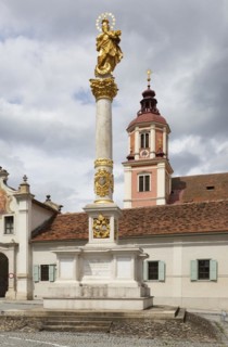 Marian column on the main square with the collegiate church of St. Vitus