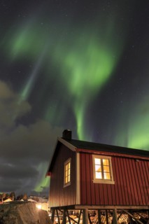 Northern Lights or Aurora Borealis over red rorbuer