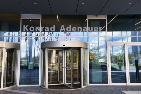 Entrance with revolving door and lettering