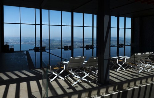 Infinity Swimming Pool with Window View over City and Lake Lucerne in Sunny Day in Lucerne