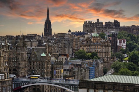 View from Calton Hill over Edinburgh's historic Old Town with The Hub events centre tower and Edinburgh Castle