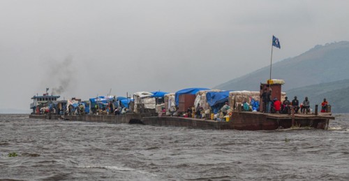 Overloaded riverboat on the Congo river
