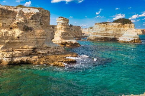 Rock stacks and crystal clear sea of the Faraglioni di Sant Andrea