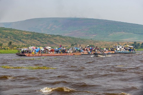 Overloaded riverboat on the Congo river
