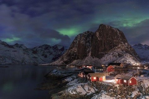 Northern Lights or Aurora Borealis over red rorbuer
