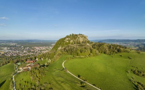 The volcanic cone Hohentwiel with the castle ruins illuminated by the evening sun