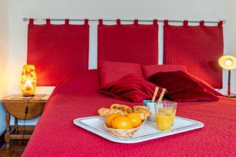 Breakfast on a red bed