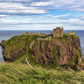 Rocky headland with castle ruins