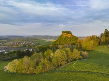The Hegau volcano Hohenkraehen illuminated by the evening sun