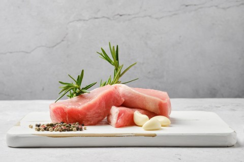 Slices of pork escalope on the table