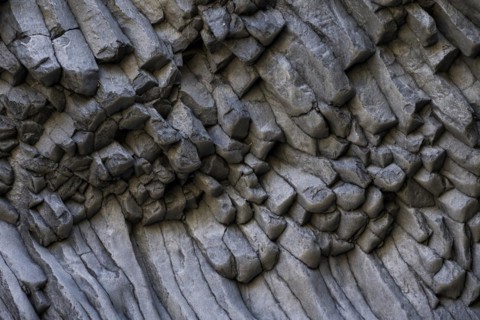 Rock formations of basalt and lava rock in the river park Gole dell' Alcantara