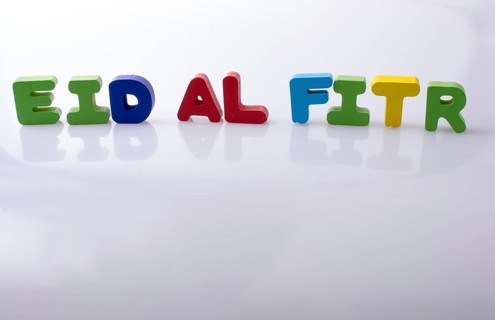 The word EID EL FITR written with colorful letter blocks