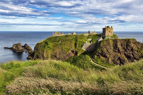 Rocky headland with castle ruins