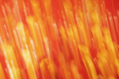 Red tone blurs the bokeh light. Defocused Red and orange holiday bokeh. Abstract christmas background