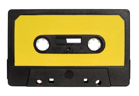 Magnetic tape cassette isolated over white