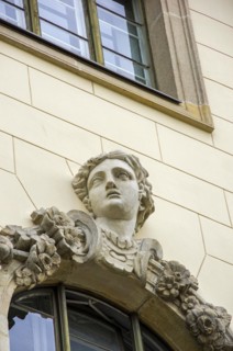 Facade detail with window and beautiful woman's head