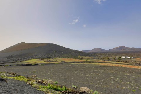 Vineyards around La Geria with the mountain Montana Chupaderos