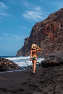 Enjoying the holidays on the black volcanic sand beach of El Ingles in Valle Gran Rey on La Gomera