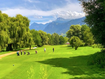 Golf Course Sierre Hole 18 with Mountain View and Clouds in a Sunny Summer Day in Granges