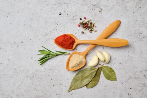 Top view of spice and herbs for cooking on concrete background