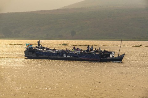 Overloaded riverboat on the Congo river