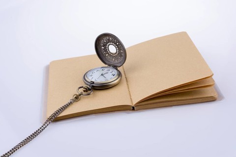 Retro style pocket watch on white background