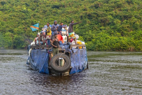 Overloaded riverboat on the Congo river
