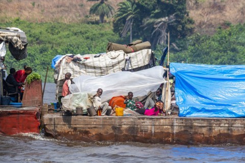 Overloaded riverboat on the Congo river