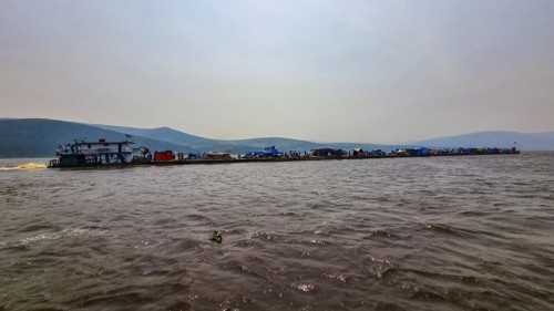 Overloaded riverboat on the Congo river