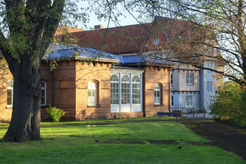 Historic brick building behind the former sulphur bathhouse