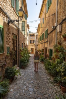 Tourist walking through alley