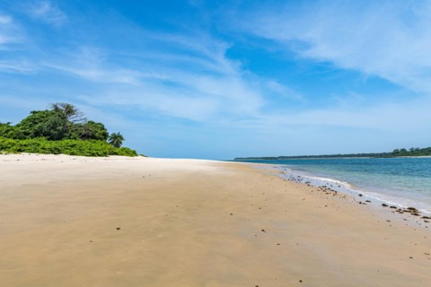 Long sandy beach on a little islet in Marinho Joao Vieira e Poilao National Park