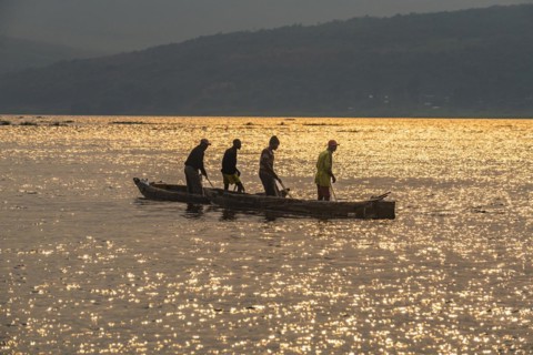 Fishermen at sunset on the Congo river