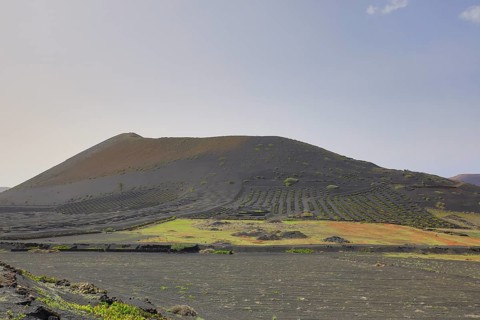 Vineyards around La Geria with the mountain Montana Chupaderos