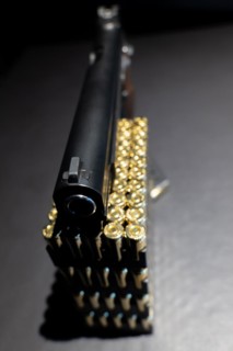 Elegant Semiautomatic 9mm Handgun Leaning on Bullet Ammunition in Switzerland