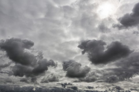 Sun shining through gap in clouds