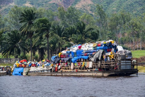Overloaded riverboat on the Congo river