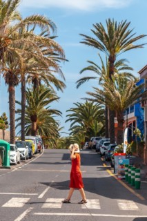 Tourist walking through the town of Valle Gran Rey on La Gomera