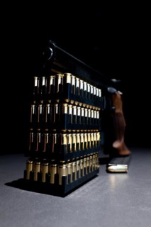 Elegant Semiautomatic 9mm Handgun Leaning on Bullet Ammunition in Switzerland