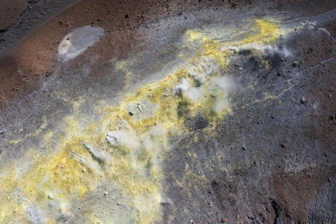 Smoking sulphur fumaroles at the crater rim