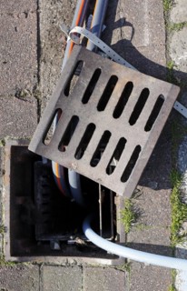 Manhole cover with water hoses
