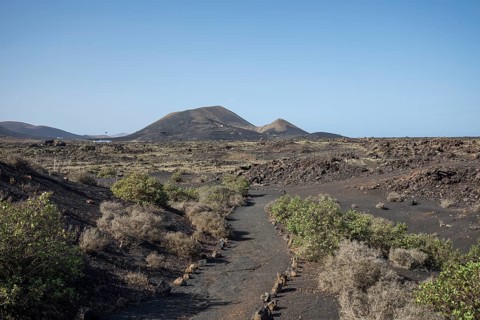 View of mountain range with volcanoes in Timanfaya National Park