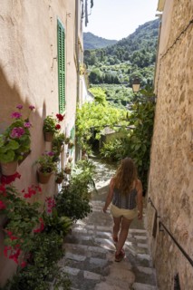 Tourist walking through alley