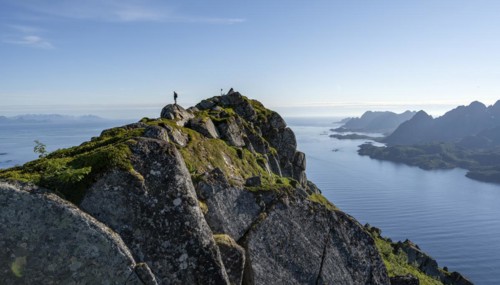 Hikers at the top of Dronningsvarden or Stortinden