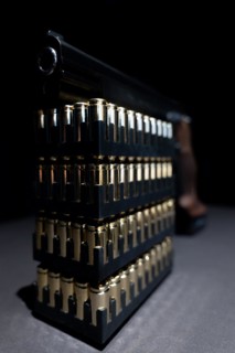Elegant Semiautomatic 9mm Handgun Leaning on Bullet Ammunition in Switzerland