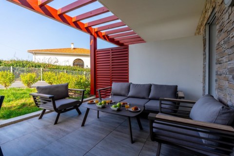 Summer house terrace. Beautiful terrace with breakfast prepared at dawn next to the garden