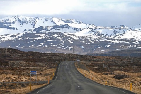 Road near Stykkisholmur in the north of the Snaefellsnes peninsula with view of snow-capped mountains