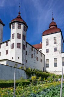 View of castle garden and baroque Laeckoe Castle on Kallandsoe in Vaenern in Vaestergoetland