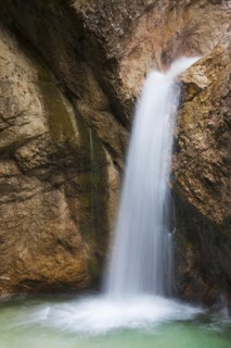 Waterfall in the river Almbach running through the Almbachklamm canyon in the Berchtesgaden Alps