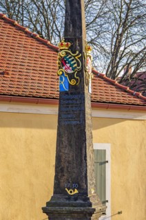 Historic Electoral Saxon post office milepost in front of the main entrance to Moritzburg Castle near Dresden